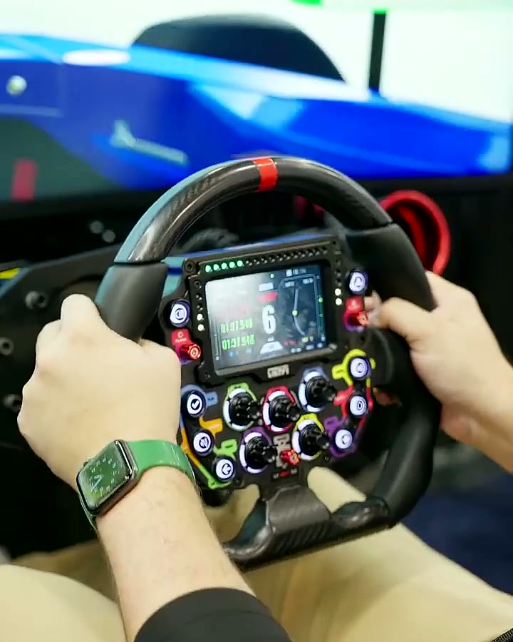 Close-up of a professional F1-style steering wheel in a driver’s hands