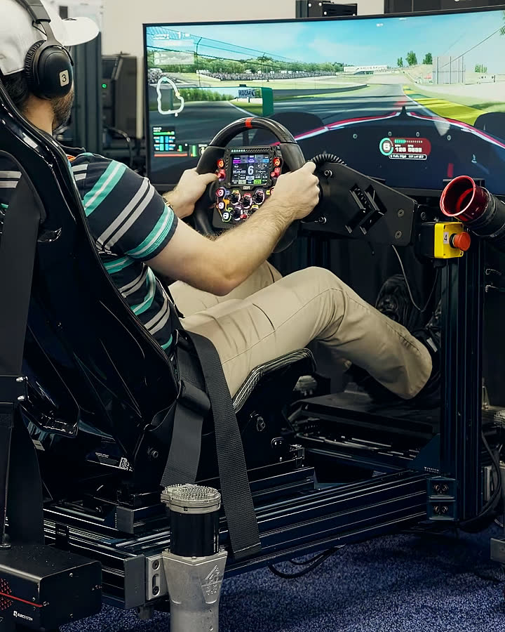 A guest at the wheel of a full-motion Trackside simulator